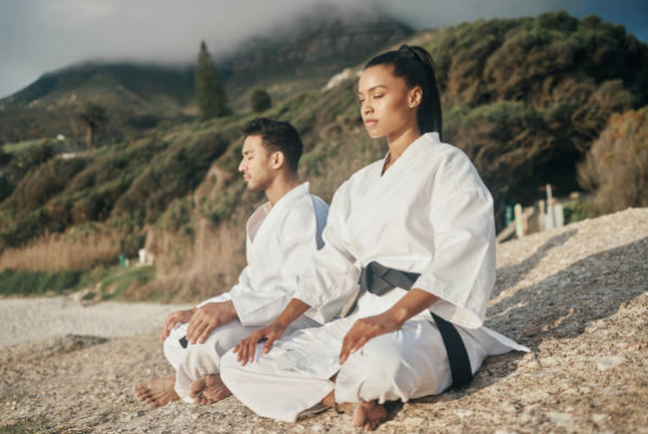 A man and a woman meditating